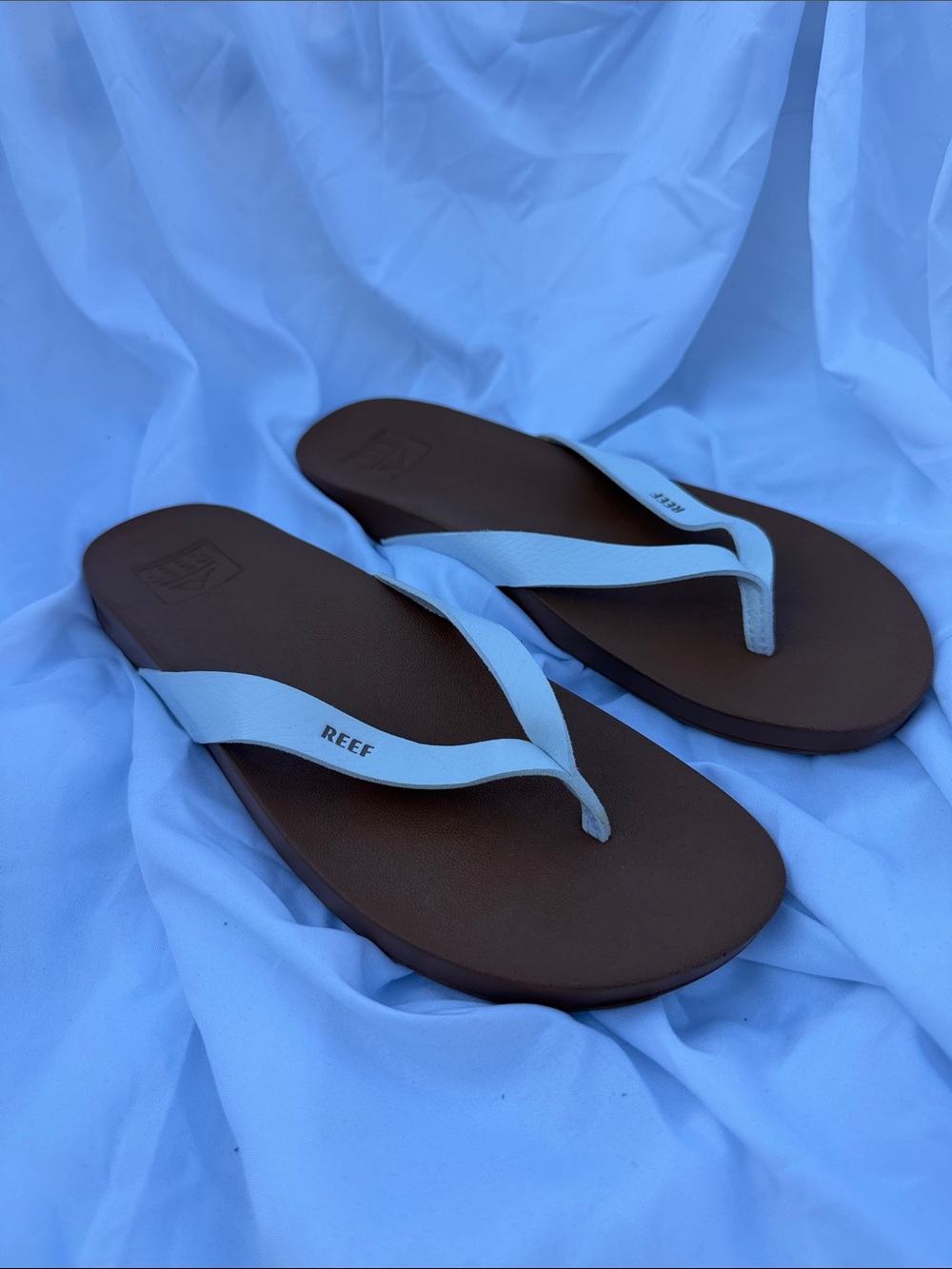 Reef Women's Brown Footbed Flip Flops with White Straps